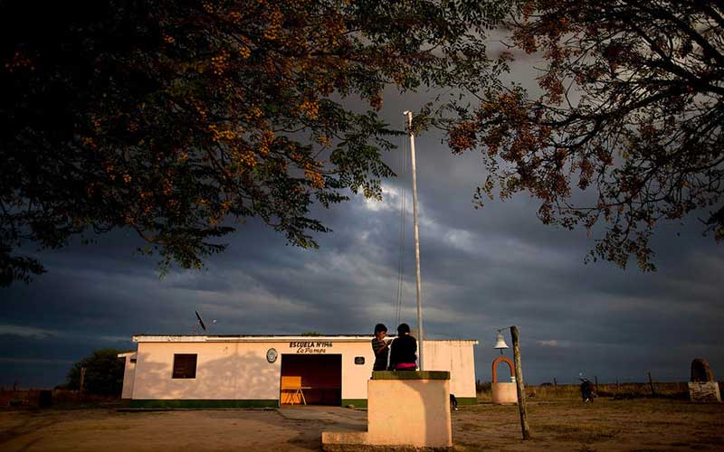 students-stand-outside-their-rural-school-in-Pozo-del-Toba